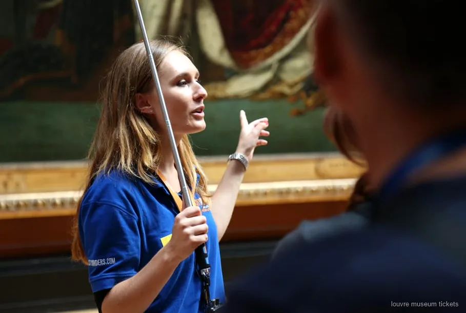 Guide leading a small group past Louvre Museum masterpieces including the Mona Lisa