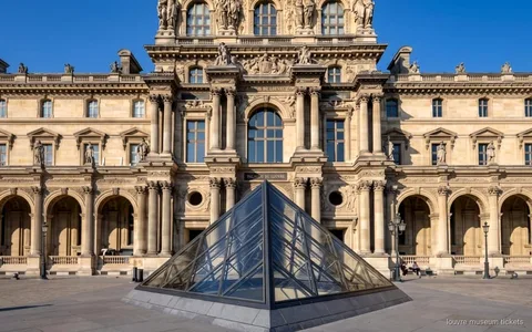 Visitor using an audio guide for a self-guided Louvre Museum reserved entry ticket